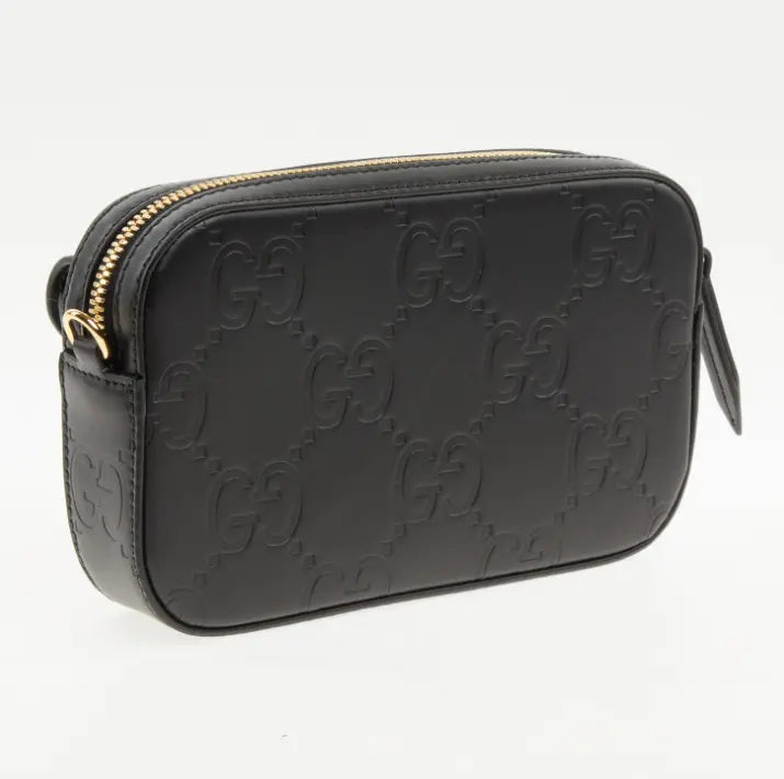 Bolso Gucci negro con cierre de cremallera y bolsillo exterior 