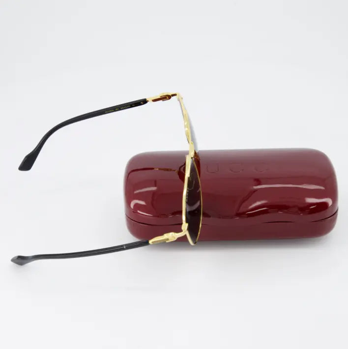 Lentes tintadas UV400 en gafas Gucci aviador dorado