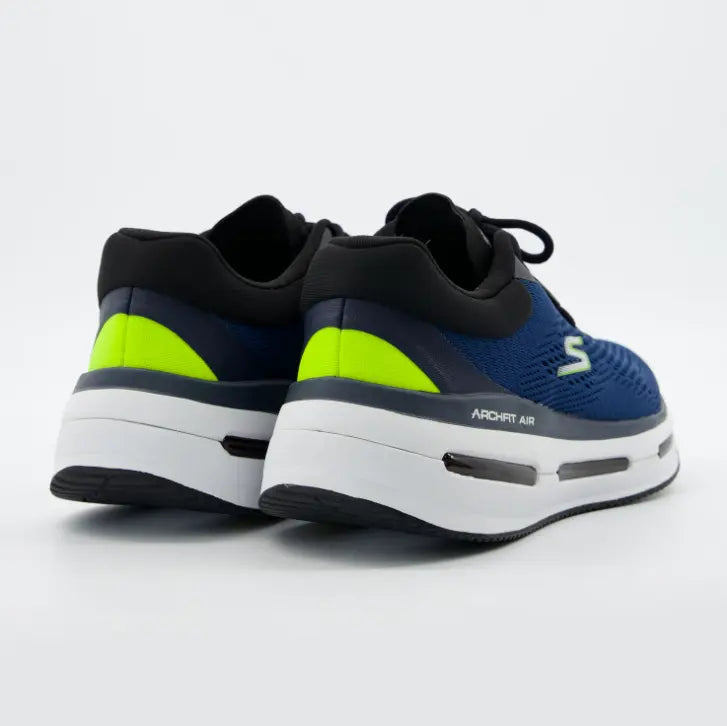 Vista del talón con detalles verde lima vibrante y media suela blanca gruesa con cámara de aire visible de las Skechers Arch Fit Air.