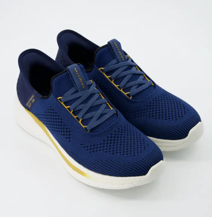 Zapatillas Skechers Hands Free Slip-ins Vapor Foam en azul marino con detalles dorados, malla técnica transpirable y suela blanca.